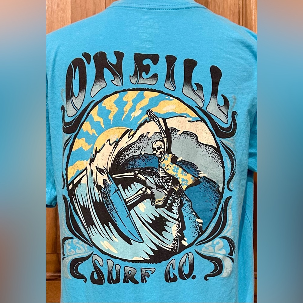 O’Neill Surf Co Bright Blue Grahic Tee - Sun/Wave/Skeleton Surfer - EUC - M